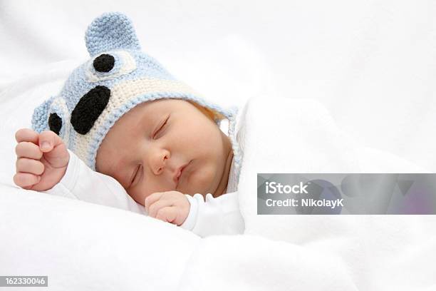 Baby Sleeping With A Blue Beanie On Stock Photo - Download Image Now - Baby - Human Age, Winter, Hat