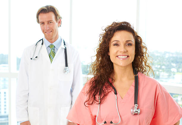 istock Happy Male and Female Doctors 162330095
