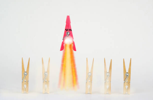 istock business concept, thinking outside the box, idea,start up,human resources,innovation success with clothespins,  a red one transforms into a launching rocket 1623307471