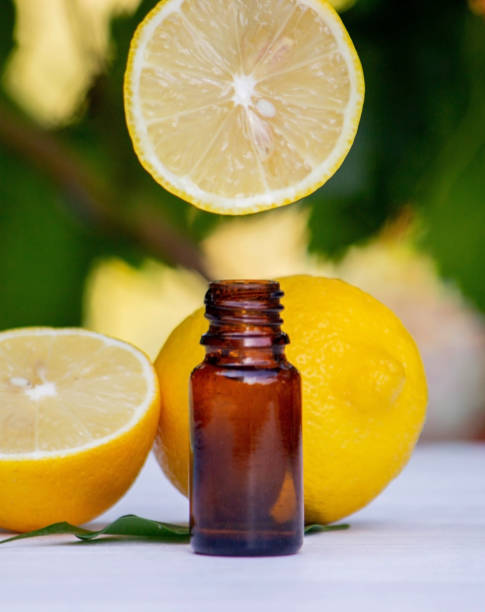 istock lemon essential oil and lemon fruit on a wooden white board. 1623313856