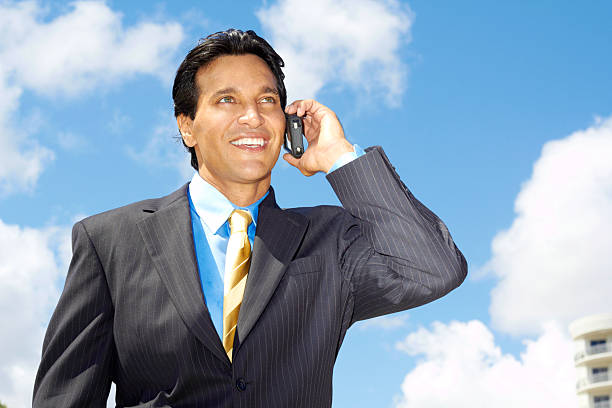 istock Cheerful Young Latin Businessman On Call 162332190