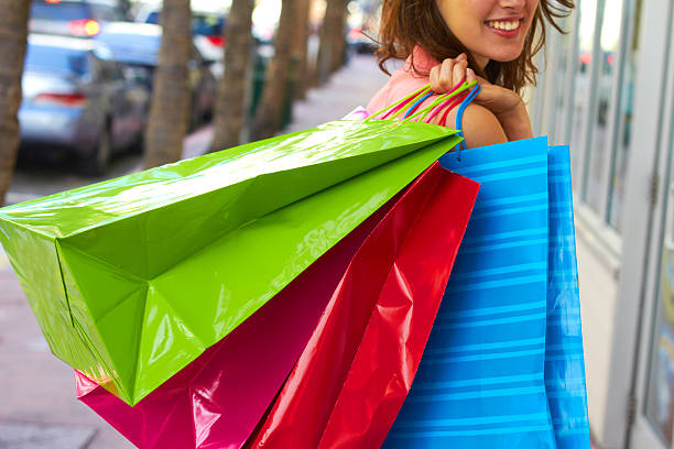 istock Young Woman With Multi Colored Shopping Bags 162332276