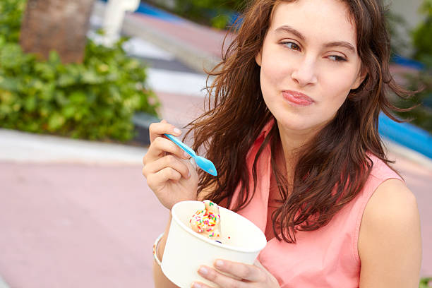 istock Young Female Eating Ice Cream 162332303