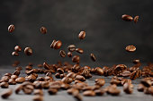 Falling brown coffee beans