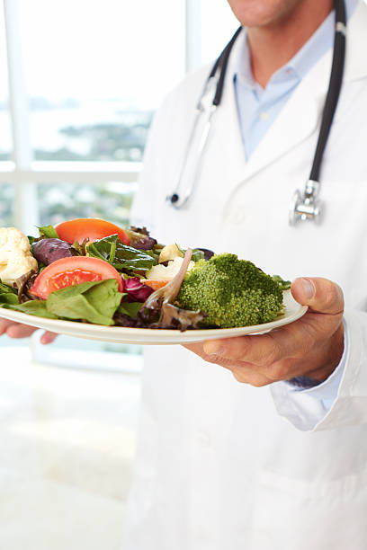 istock Doctor holding a fresh salad 162332969