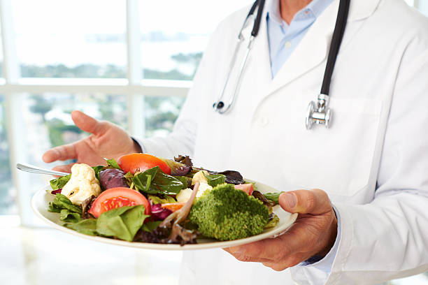 istock Doctor holding a fresh salad 162332972