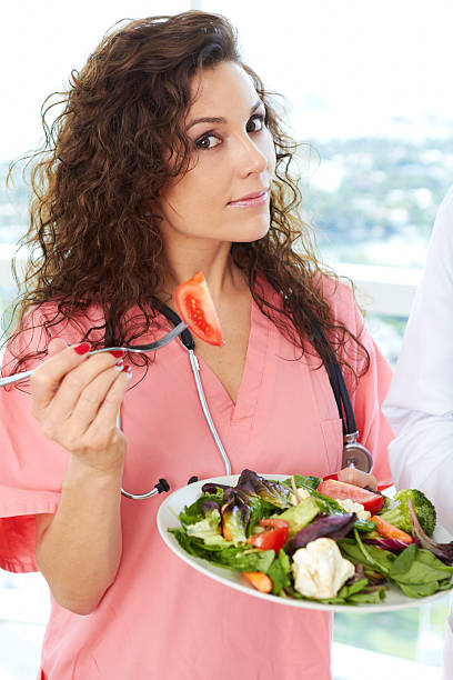istock Close-up of a nurse holding salad 162333036