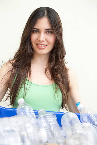 istock beautiful female holding recycling bin 162333312