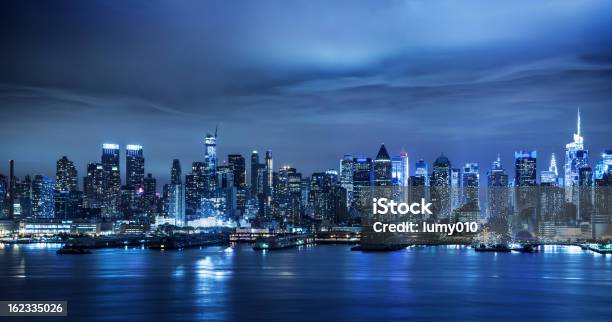 Manhattan Skyline At Night Stock Photo - Download Image Now - Night, New York City, Urban Skyline