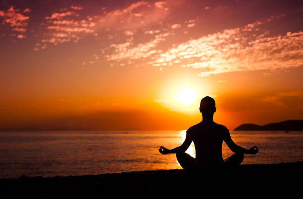 istock Yoga meditation at sunset 162335529