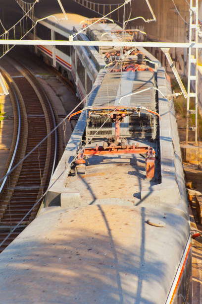 Railway, bridge, directly above view of commuter train. Barcelona, Catalonia, Spain.