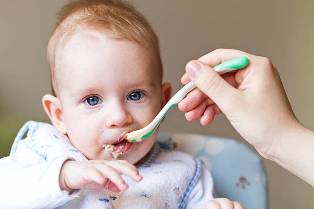 istock Hungry toddler eating porridge 162337011