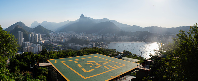 Rio de Janeiro, Brazil: panoramic view from Sugarloaf Mountain with helicopter landing pad and view of Humaitá district, the Christ the Redeemer on the top of Mount Corcovado and Botafogo beach