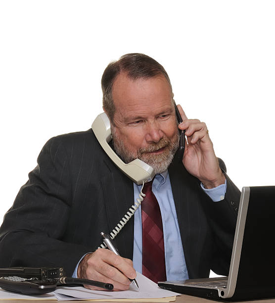 Busy businessman has it under control stock photo