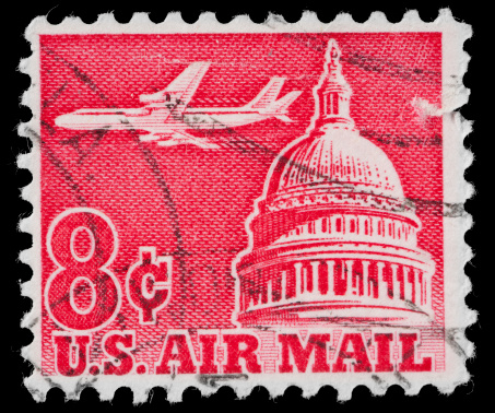 A United States Air Mail Stamp with the US Capitol Dome Building and a four engine Jet Aircraft. The United States Capitol is the meeting place of the United States Congress, the legislature of the Federal government of the United States. Located in Washington, D.C., it sits atop Capitol Hill at the eastern end of the National Mall. The Cast-iron Dome is in the \