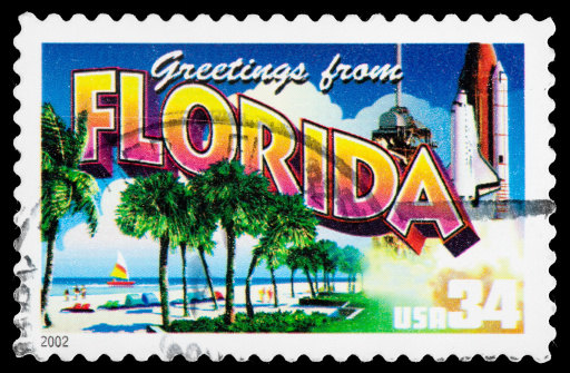 Florida State Postage Stamp Greetings From America Retro Postcard Theme. This Postage Stamp Program celebrated each of the 50 USA States with a retro postcard theme. These Colorful 32 cent stamps were released on April 4, 2002. The retro design of these stamps resembles the large letter postcards that were popular with tourists in the 1930's and 1940's and conveys a nostalgia for all aspects of popular American culture   