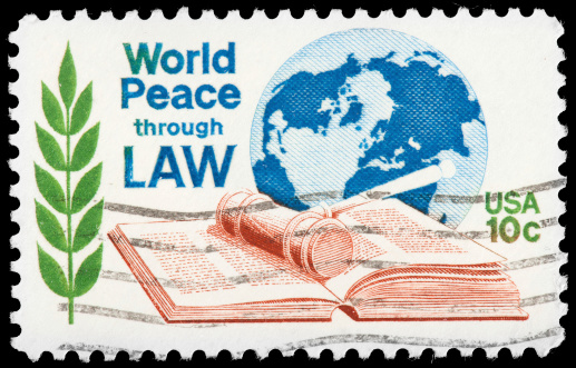 World Peace Through Law US Postage Stamp Depicting Images of the World Globe, Gavel, Law Book and Olive Branch.