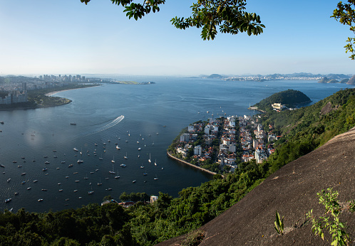 Rio de Janeiro, Brazil: the skyline of Rio on the left, with Urca district below, and  the municipality of Niteroi on the right seen from Morro da Urca (Urca Mountain), first station of the Sugarloaf Cable Car