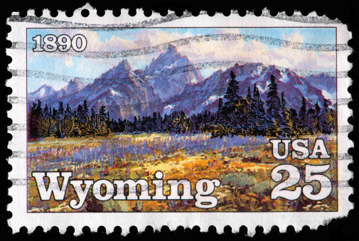 Wyoming Show-capped Mountains, 1890 Statehood Depicted on Vintage US Postage Stamp. Wymoing was admitted to the USA Union in 1890.