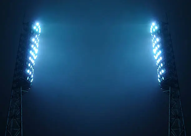 Photo of Stadium Floodlights against Dark Night Sky