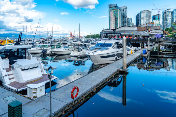 Vancouver, British Columbia - July 25, 2023: The view of Coal Harbour seaside park, Vancouver, Canada.