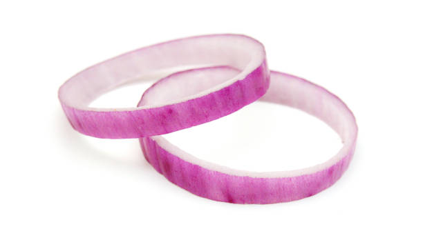 istock Red onion rings on white background 1623440838