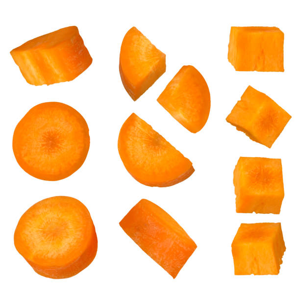 istock Carrot slices isolated on white background. Carrots of different cutting methods are suitable for an advertising banner. 1623496636