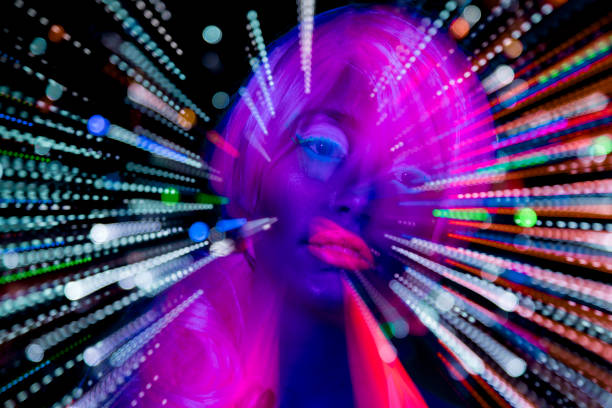 istock Female dancing in glow UV costume 1623505912