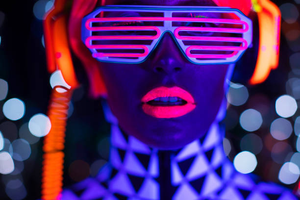 istock Female dancing in glow UV costume 1623510826