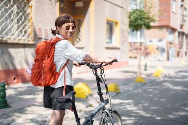 istock Korean Woman walking with bike 1623515744