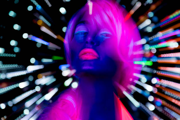 istock Female dancing in glow UV costume 1623520068