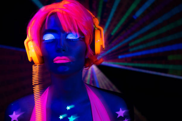 istock Female dancing in glow UV costume 1623524859