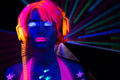 Female dancing in glow UV costume