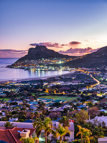 Long exposure vertical shot of hout bay town, harbour and the fishermen town at dusk, Cape Town, South Africa