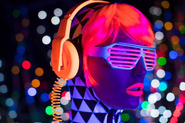 istock Female dancing in glow UV costume 1623527734