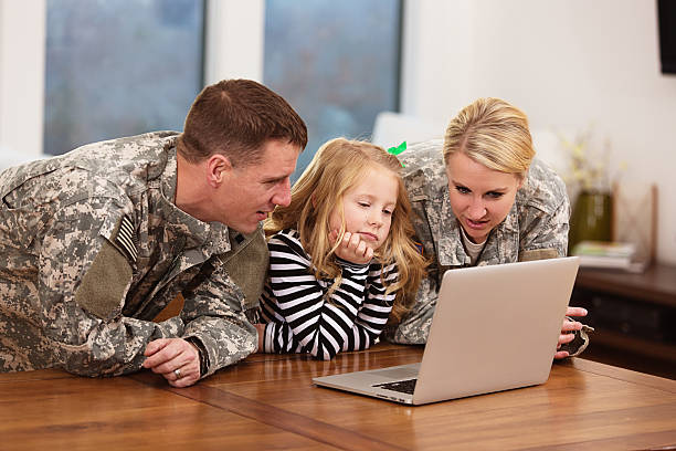 Military family looking at a laptop