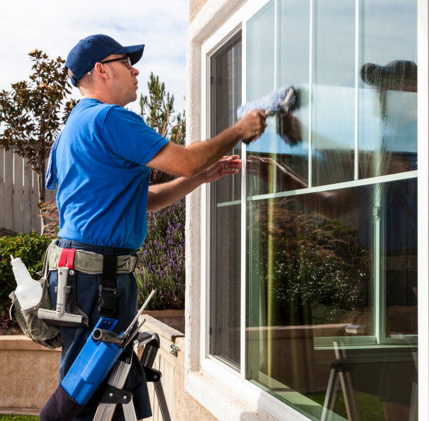 Window Cleaning Man cleaning window of a home. house washing stock pictures, royalty-free photos & images