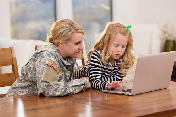 istock Mother and daughter looking at a laptop together 162353094
