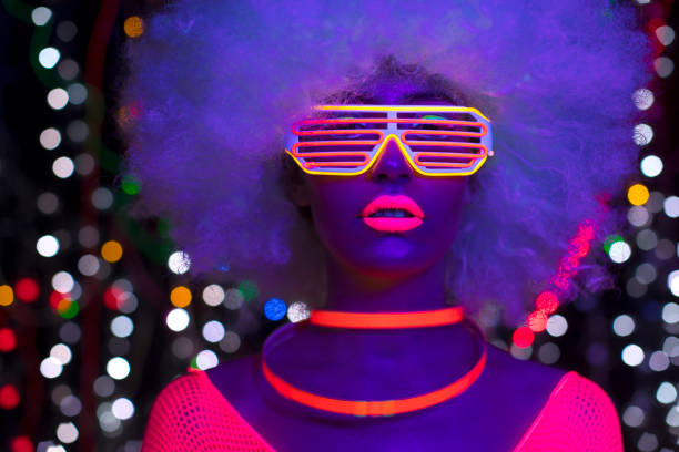 istock Female dancing in glow UV costume 1623531476