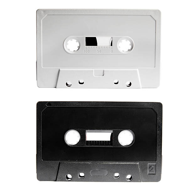 Gray and black plastic audio tapes isolated on white background.