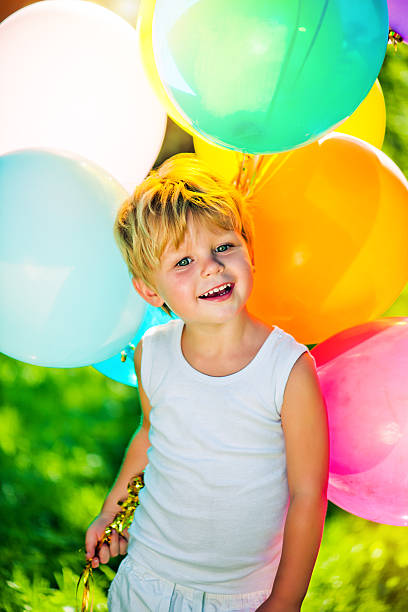 istock Cute boy with balloons 162355569
