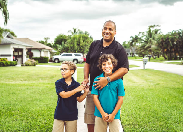 istock Happy father outdoors being playful with his two sons 1623568414