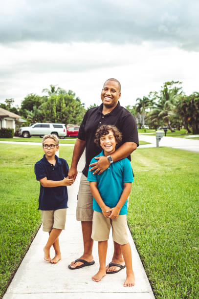 istock Happy father outdoors being playful with his two sons 1623569037