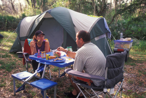 istock Couple having breakfast in a campground 1623569725