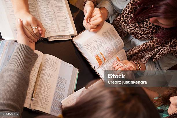 Women Bow And Pray Stock Photo - Download Image Now - Bible, Studying, Women