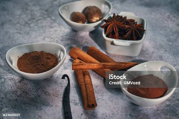 Variation Of Spices Chili Powder Cinnamon Cayenne Pepper Nutmeg And Star Anise Stock Photo - Download Image Now