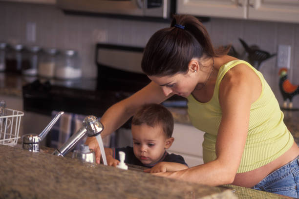 istock Pregnant woman with son in the kitchen 1623601204