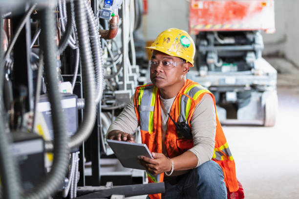 istock Worker inspecting industrial refrigeration equipment 1623611479