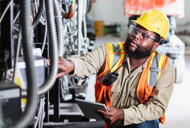 istock Worker inspecting industrial refrigeration equipment 1623611491