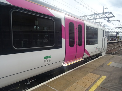 Stratford, United Kingdom – August 09, 2023: A modern C2C train making a trial stop at Stratford station